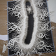 Illustration for article titled This haunting bacteria is actually an intricate hand-cut paper sculpture